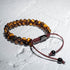 Zweireihiges Armband aus gelbem Tigerauge – edle Natursteinperlen auf weißem Hintergrund, 6 mm Kugeln, Premium-Makramee-Verschluss von UNIQAL